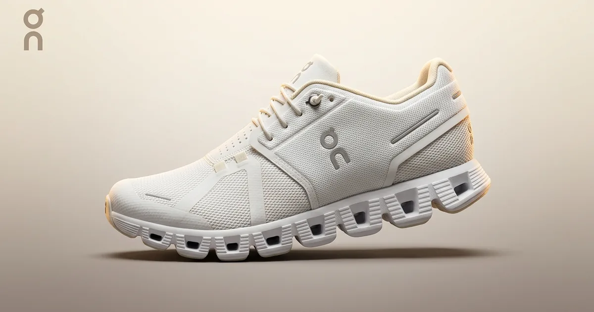 Premium photoreal product close-up of a single white-and-cream On Cloud running shoe with its distinctive CloudTec sole pods, three-quarter side view on a clean warm cream-to-taupe studio gradient backdrop, with a small ON brand logo lockup in the upper-left corner