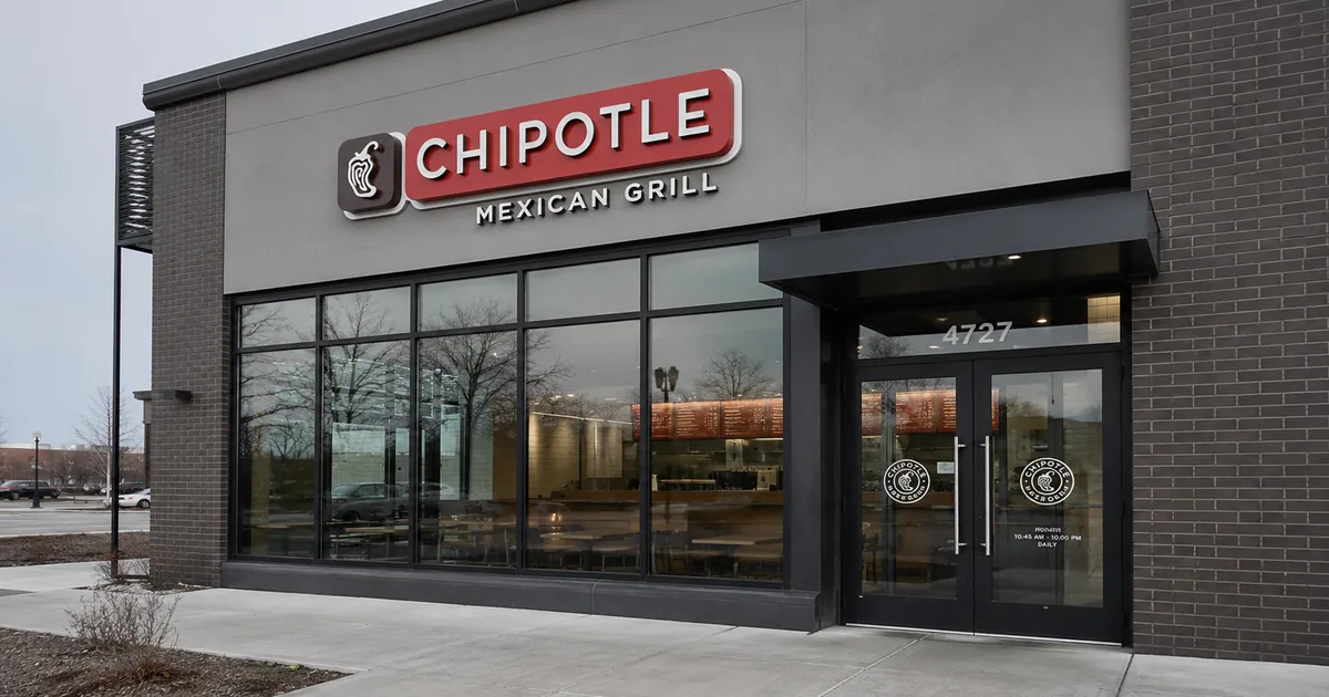 Exterior of a Chipotle Mexican Grill restaurant with its logo sign on an overcast day